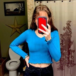 Cropped lettuce hemmed sweater shirt